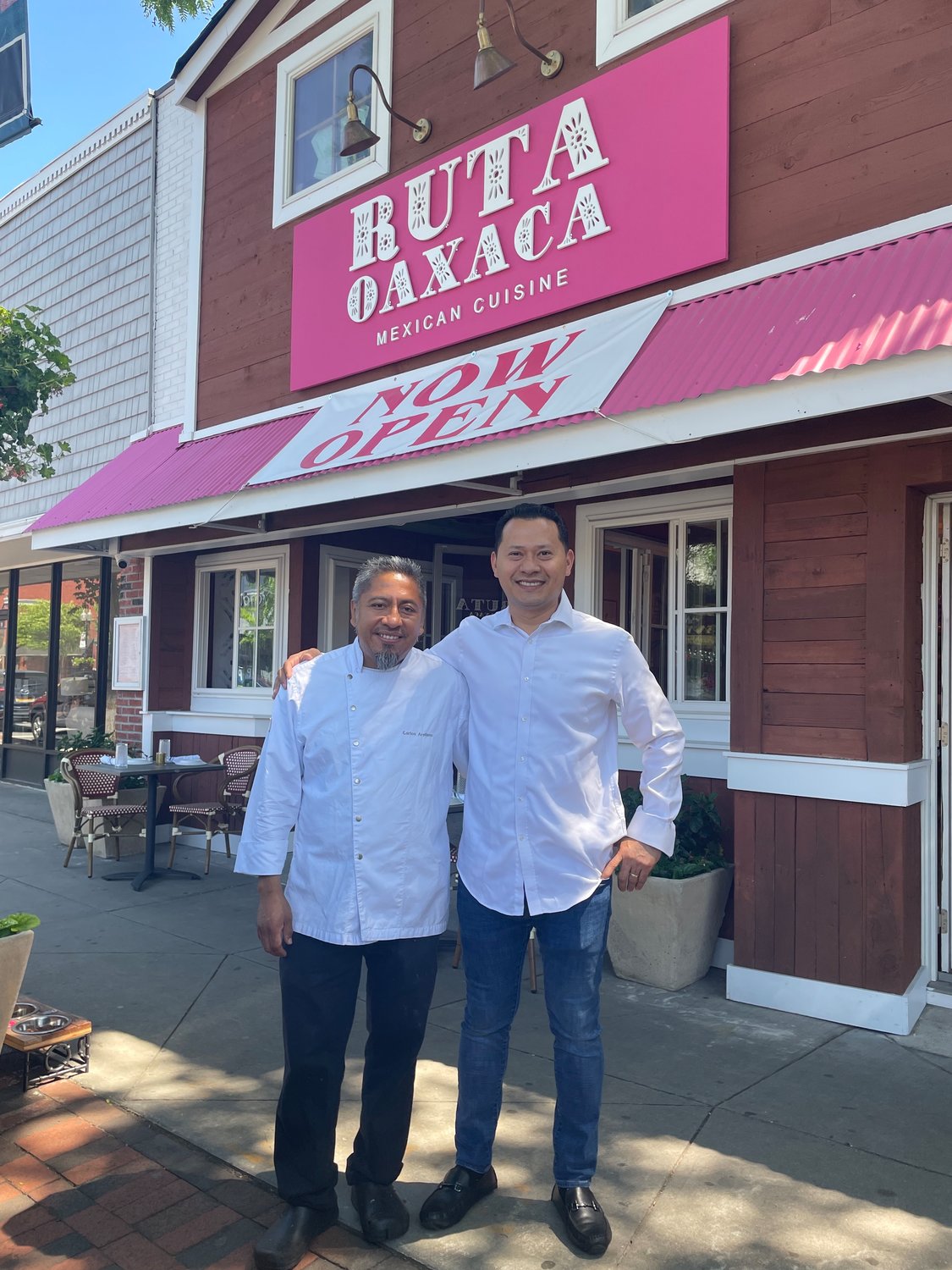 Co-owners Jose Castillo (right) and chef Carlos Arellano (left) stand outside their home-gourmet inspired Mexican restaurant.